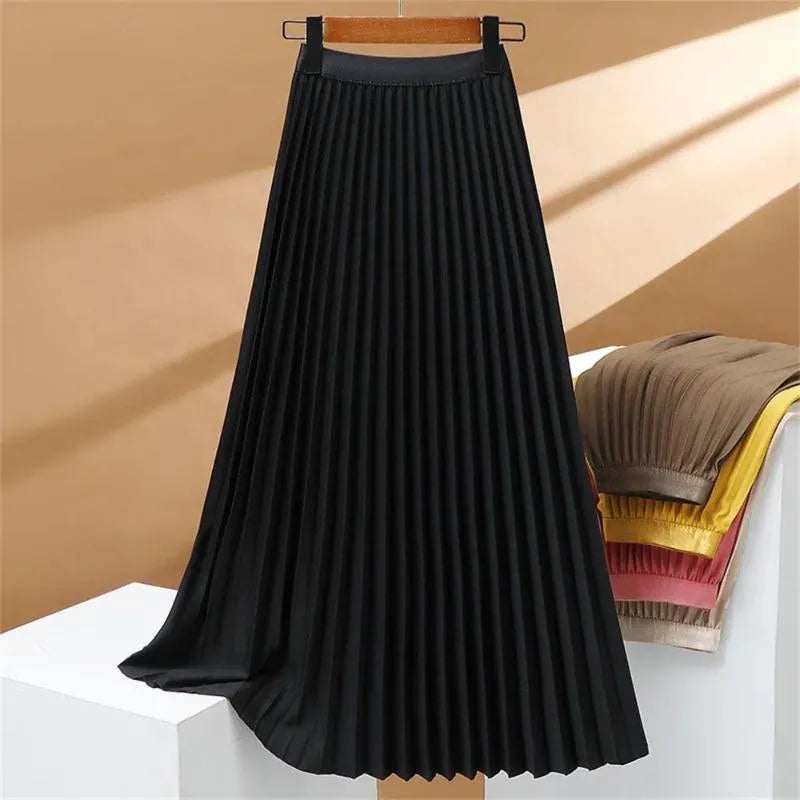 Gonna lunga plissettata elasticizzata a vita alta, elegante e confortevole, perfetta per un look sofisticato e femminile.