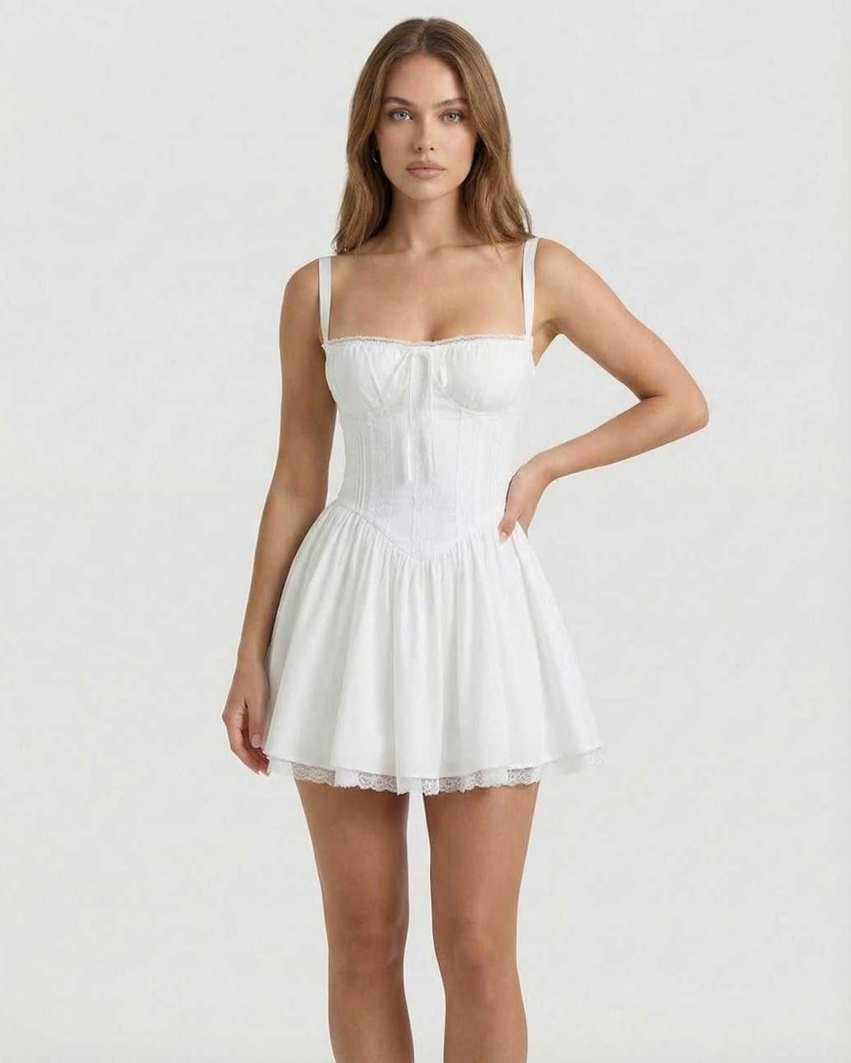 Elara Mini Dress - White corset style mini dress with lace trim by Lauven, offering feminine charm and a structured silhouette.