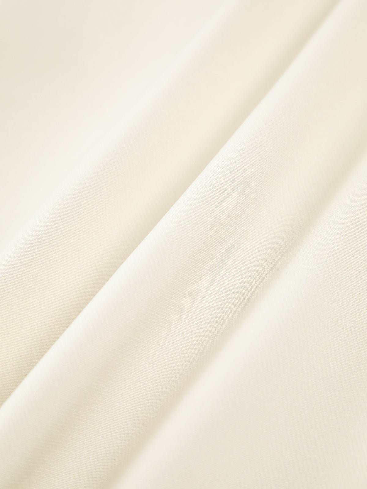Top a tinta unita con pantaloni a gamba larga